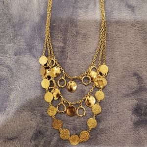 White House black market gold coin necklace